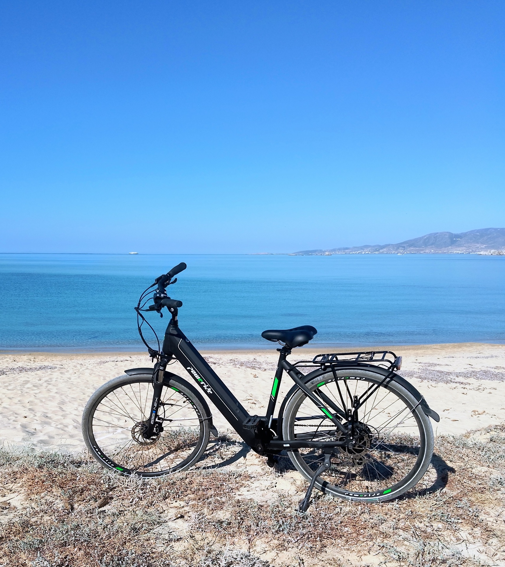 Modern e-bike parked by the Aegean coast in Naxos
